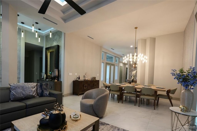 2511 Wisteria St, Mission, TX 78574 - living room featuring light marble finish flooring and a chandelier