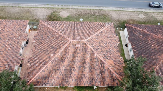 drone / aerial view with a water view and a beach view