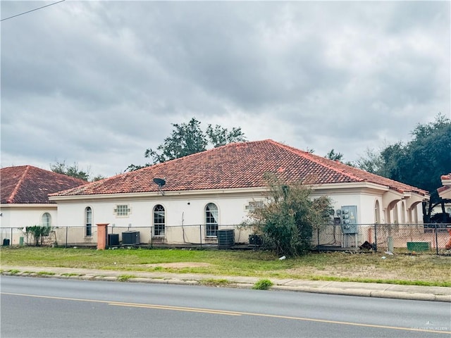 view of property exterior with central AC