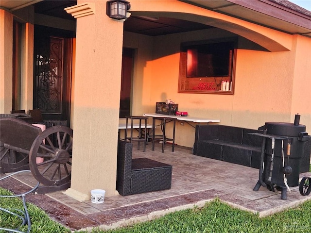 view of patio featuring an outdoor bar