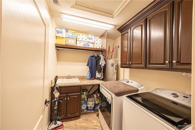 laundry area featuring cabinets, washer and clothes dryer, crown molding, water heater, and sink