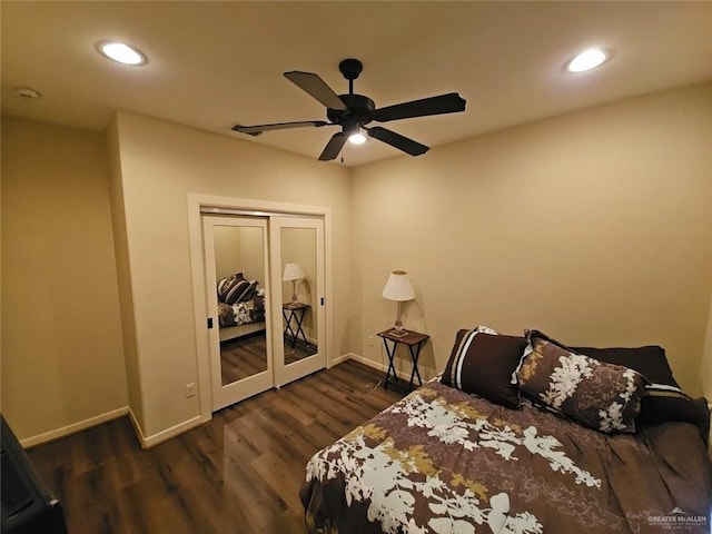 bedroom featuring french doors, ceiling fan, a closet, and dark hardwood / wood-style floors