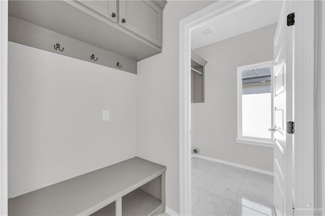 341 Leon Ave, Elsa, TX 78543 - mudroom featuring light marble finish floors and baseboards
