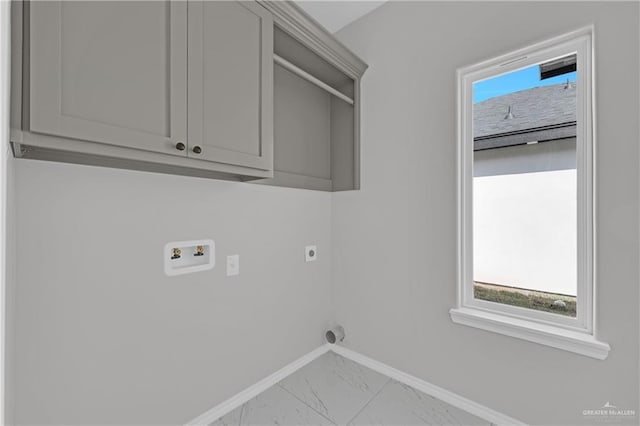 341 Leon Ave, Elsa, TX 78543 - laundry area featuring electric dryer hookup, marble finish floors, hookup for a washing machine, and cabinet space