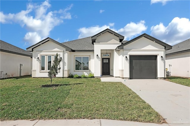 341 Leon Ave, Elsa, TX 78543 - view of front of home with concrete driveway, an attached garage, a front yard, and stucco siding