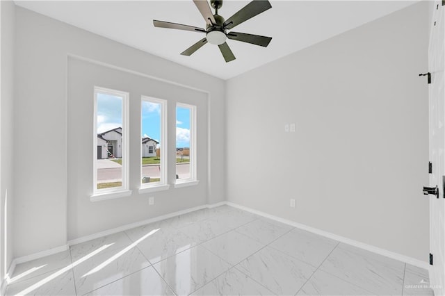 341 Leon Ave, Elsa, TX 78543 - unfurnished room with light marble finish floors and ceiling fan