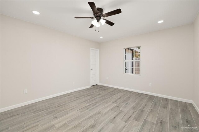 spare room with recessed lighting, baseboards, light wood-style floors, and a ceiling fan