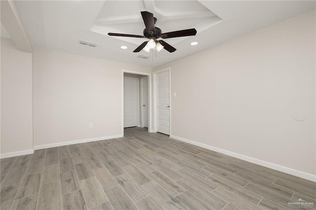 spare room featuring visible vents, recessed lighting, light wood-type flooring, and baseboards