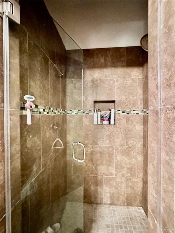 bathroom with a shower stall