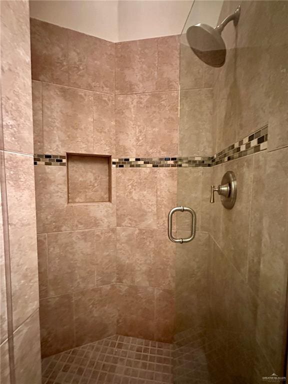 bathroom featuring a shower stall