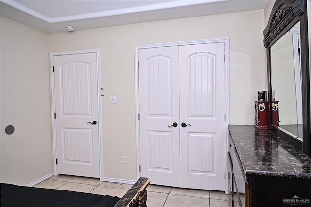 interior space with light tile patterned floors