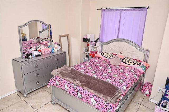 bedroom with light tile patterned floors