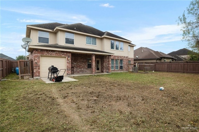 back of property with a lawn and a patio area