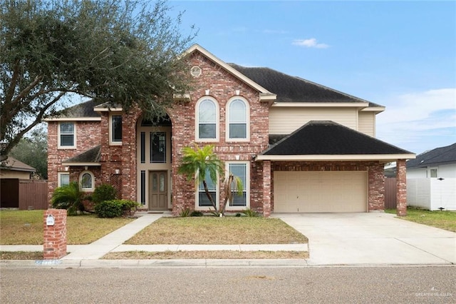 front of property featuring a garage and a front lawn