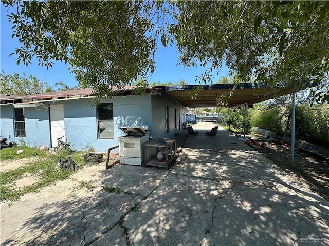 view of home's exterior featuring a carport