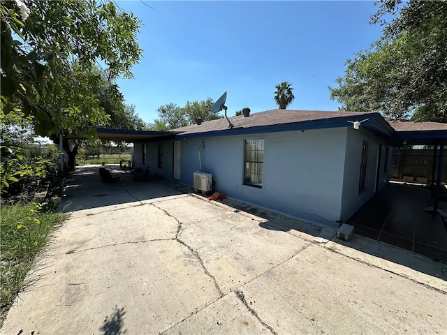 view of property exterior featuring a carport