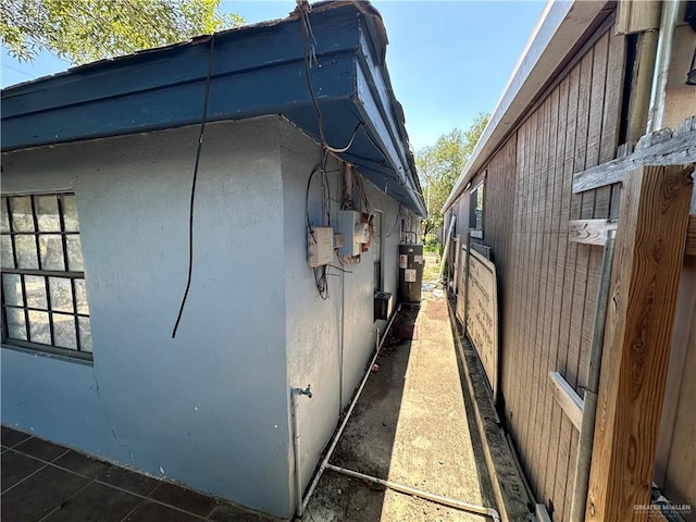 view of home's exterior with water heater