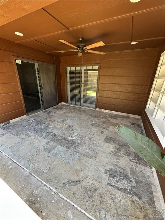 view of patio featuring ceiling fan