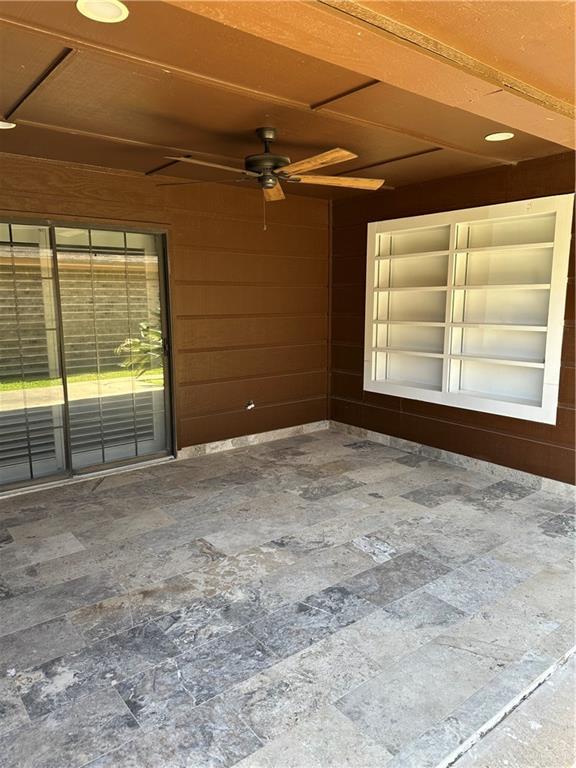 unfurnished room featuring ceiling fan