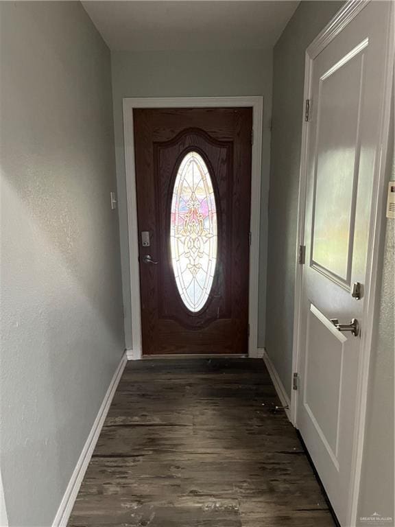 entryway featuring baseboards and dark wood-style flooring