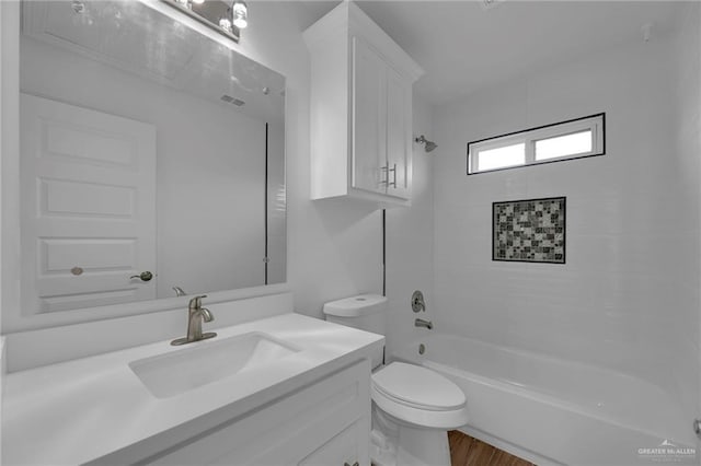 full bathroom featuring shower / tub combination, hardwood / wood-style flooring, vanity, and toilet