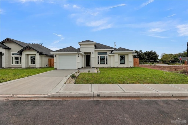 view of front facade featuring a front yard and a garage