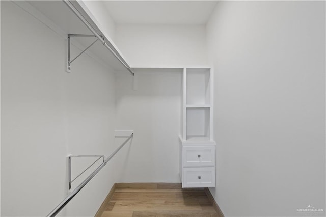 1218 N Lincoln Ave, San Juan, TX 78589 - walk in closet featuring wood finished floors