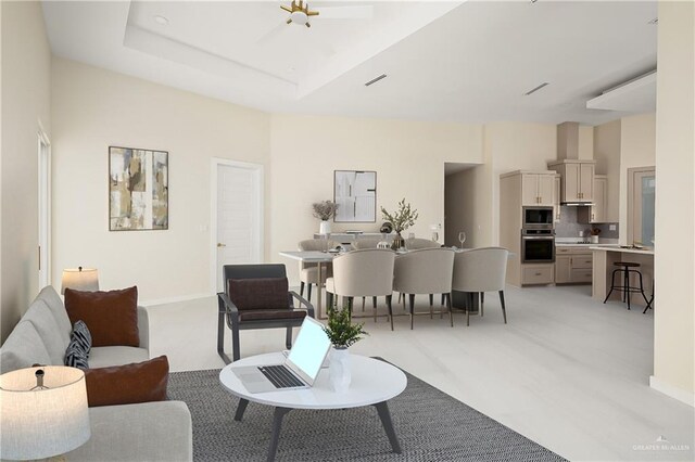 living room featuring baseboards, light carpet, and visible vents