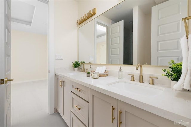 bathroom with a sink and double vanity