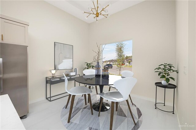 dining area featuring a chandelier, baseboards, and light carpet