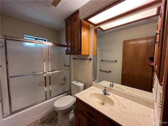 252 Rebecca Dr, Alamo, TX 78516 - full bath featuring a textured ceiling, vanity, and enclosed tub / shower combo