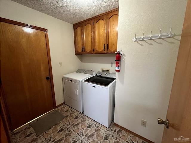 252 Rebecca Dr, Alamo, TX 78516 - laundry area featuring washing machine and dryer, cabinet space, and a textured ceiling
