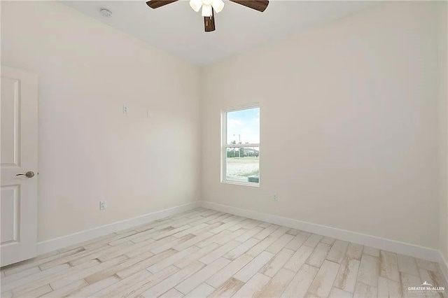 spare room featuring light hardwood / wood-style floors and ceiling fan