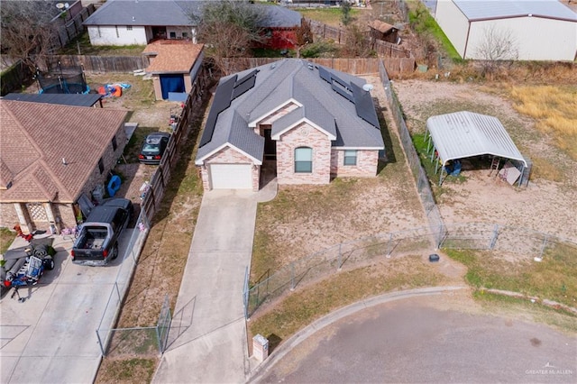 birds eye view of property with a residential view