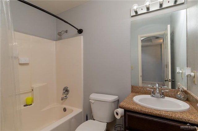 bathroom featuring toilet, vanity, and shower / bathing tub combination