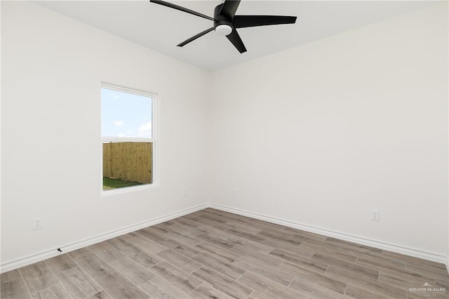 unfurnished room featuring ceiling fan and light wood-type flooring