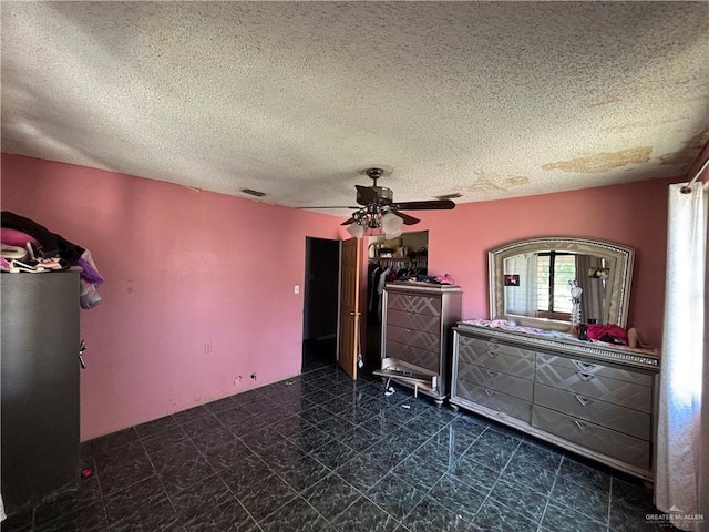 7221 S San Joaquin St, Pharr, TX 78577 - unfurnished bedroom featuring visible vents, tile patterned floors, ceiling fan, and a textured ceiling