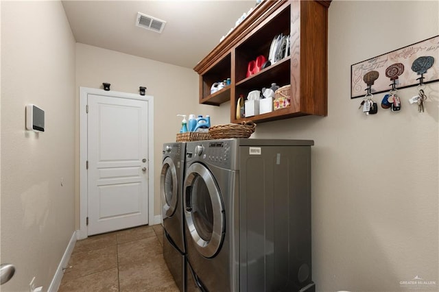 4230 Stillwater Cv, Edinburg, TX 78542 - clothes washing area featuring visible vents, tile patterned flooring, baseboards, and washer and clothes dryer