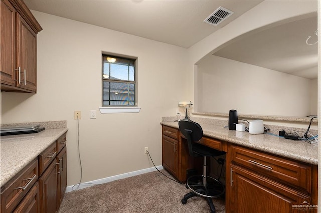 4230 Stillwater Cv, Edinburg, TX 78542 - office with built in study area, visible vents, arched walkways, baseboards, and light colored carpet