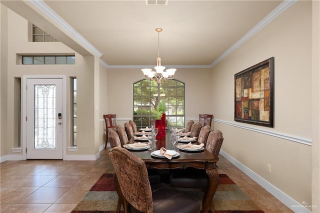 4230 Stillwater Cv, Edinburg, TX 78542 - dining space featuring baseboards, visible vents, a chandelier, tile patterned flooring, and crown molding
