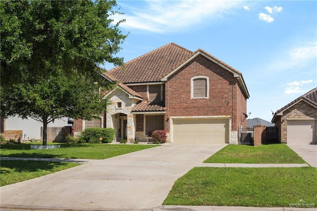 4230 Stillwater Cv, Edinburg, TX 78542 - view of front of house with a gate, a tile roof, a garage, fence, and a front yard