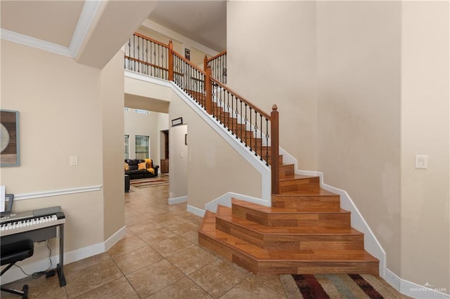 4230 Stillwater Cv, Edinburg, TX 78542 - stairs with crown molding, tile patterned flooring, and baseboards