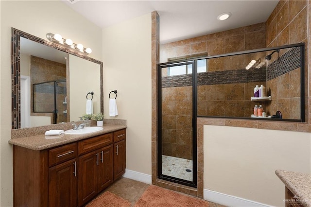 4230 Stillwater Cv, Edinburg, TX 78542 - full bathroom featuring a shower stall, baseboards, and vanity