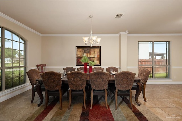 4230 Stillwater Cv, Edinburg, TX 78542 - dining area with a notable chandelier, a wealth of natural light, ornamental molding, and visible vents
