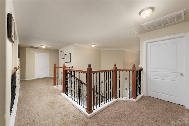 4230 Stillwater Cv, Edinburg, TX 78542 - corridor with carpet floors, visible vents, ornamental molding, and an upstairs landing