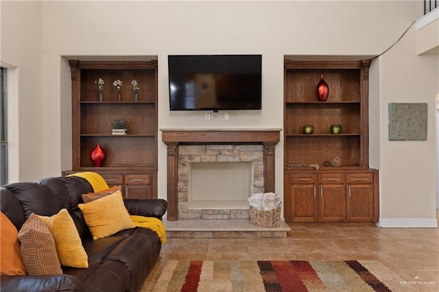 4230 Stillwater Cv, Edinburg, TX 78542 - living area featuring a stone fireplace and baseboards