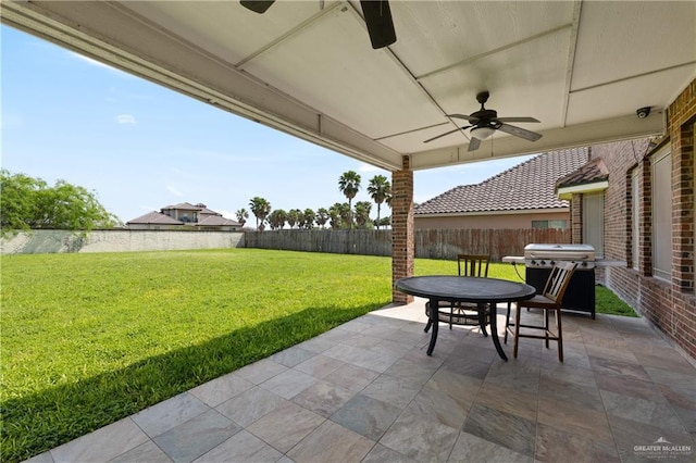 4230 Stillwater Cv, Edinburg, TX 78542 - view of patio with grilling area, a ceiling fan, outdoor dining area, and a fenced backyard