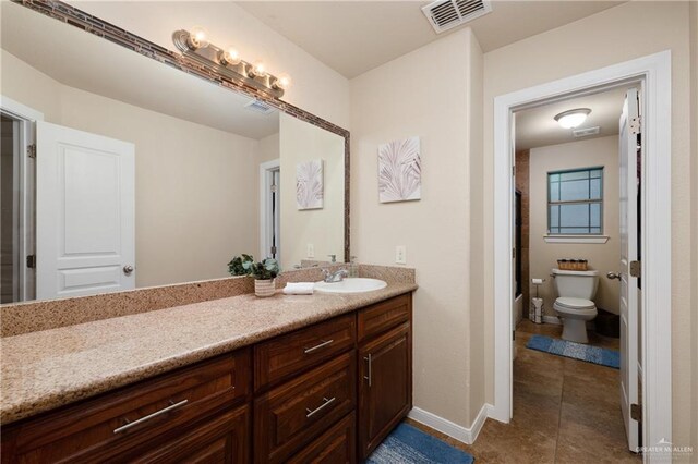 4230 Stillwater Cv, Edinburg, TX 78542 - bathroom with visible vents, tile patterned flooring, vanity, and toilet