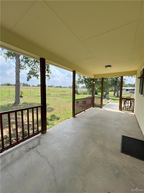 119 Cherokee Cir, Smithville, TX 78957 - covered porch featuring a yard and a view of rural / pastoral area