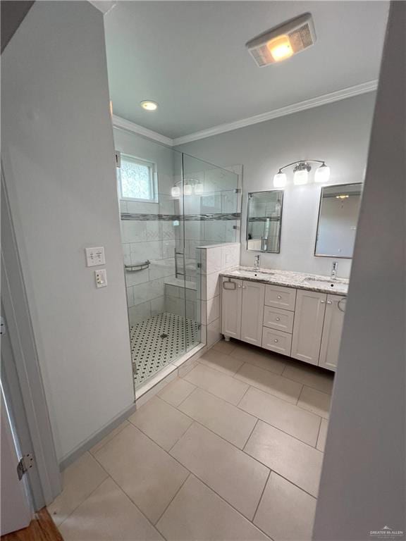 119 Cherokee Cir, Smithville, TX 78957 - bathroom featuring crown molding, double vanity, a shower stall, tile patterned floors, and recessed lighting